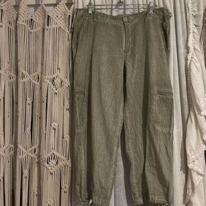 Saga with drawstring on top and the bottom , relax fit, fits like an 8,